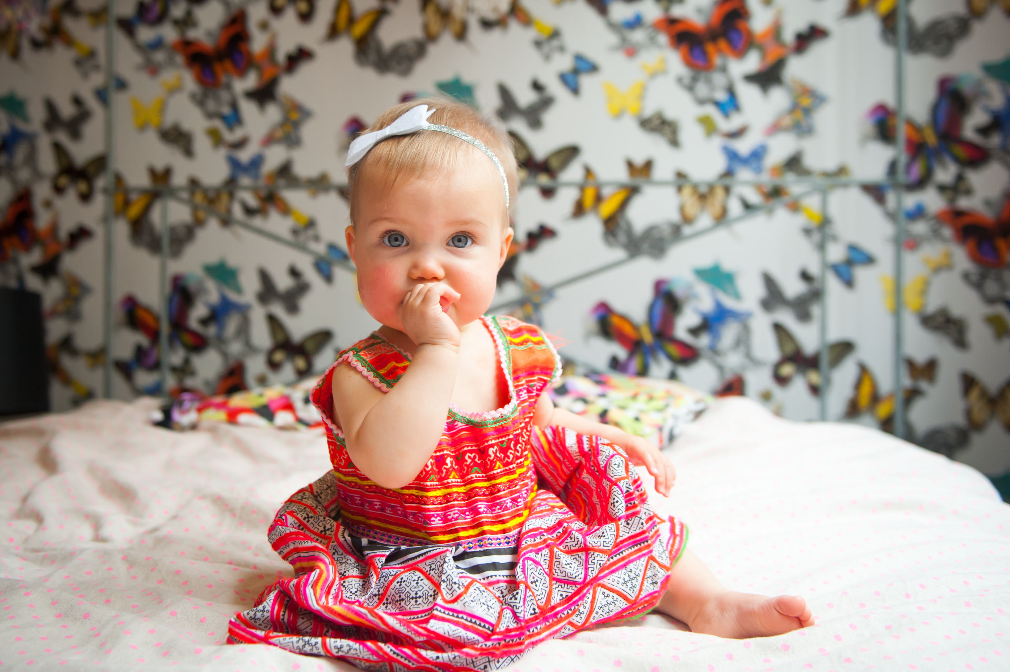 Dress handmade for Estelle in Cambodia. Headband by Little Raya Sunshine